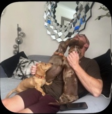 Jamie relaxing on the sofa with the dogs