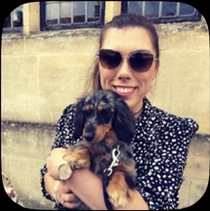 Sarah holding a dachshund puppy